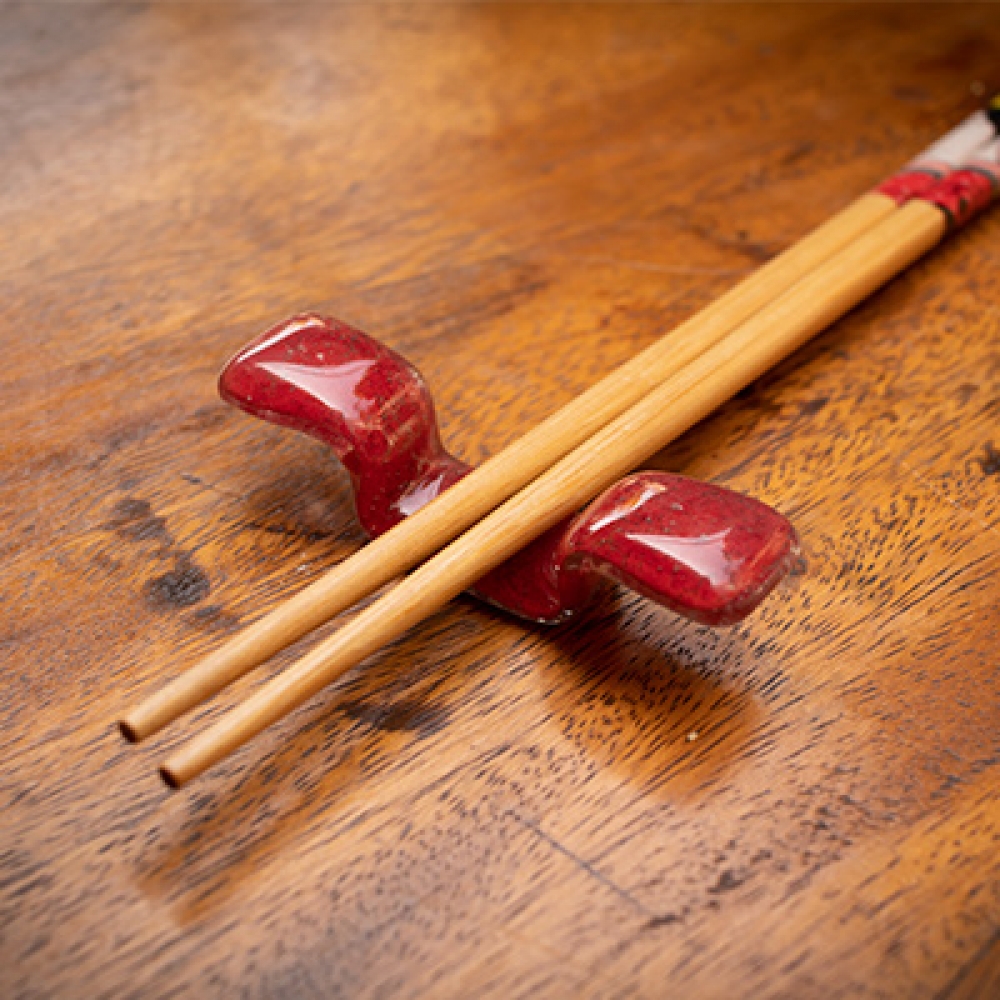Apoya palitos rojo sushi